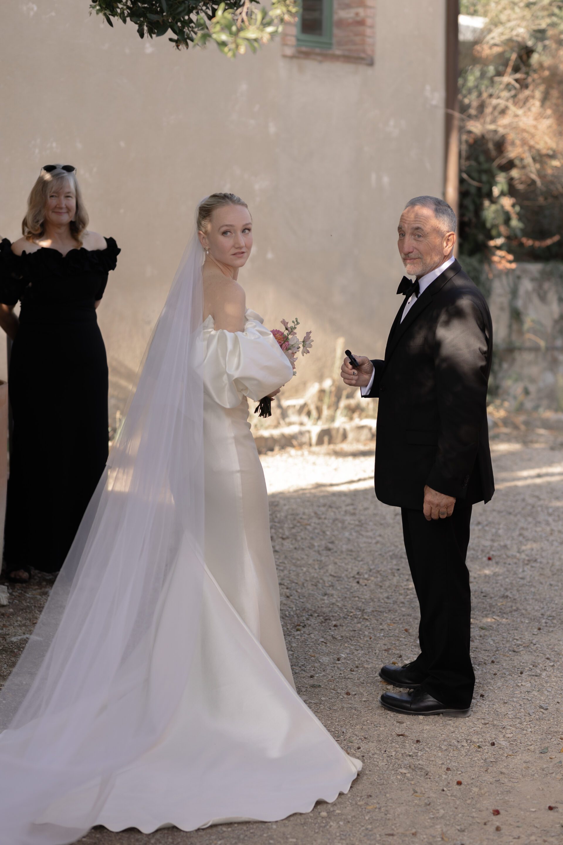 The bride shares a moment with her father before her Tuscan wedding