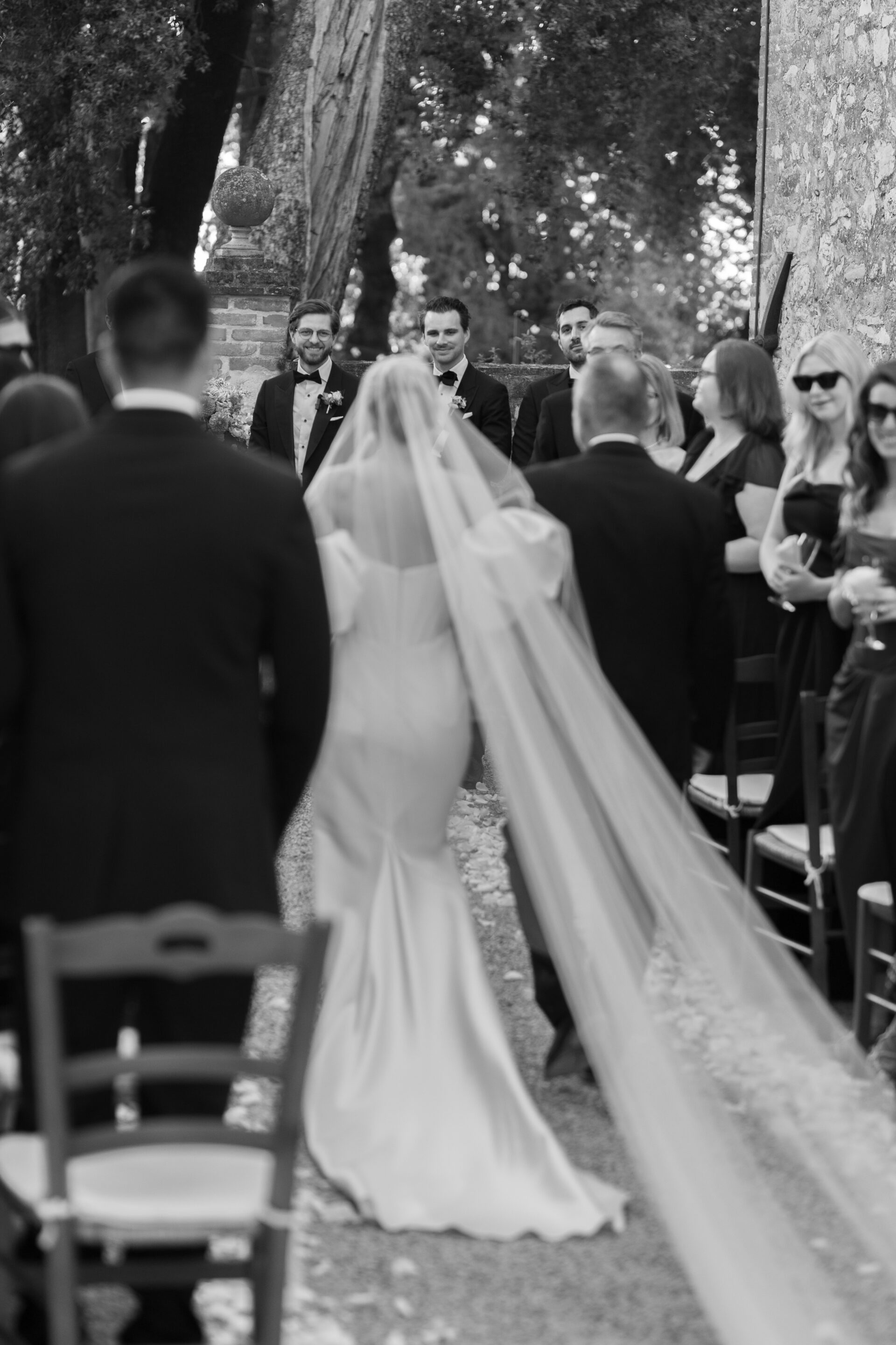 The bride walks down the aisle at her luxury Italian wedding ceremony