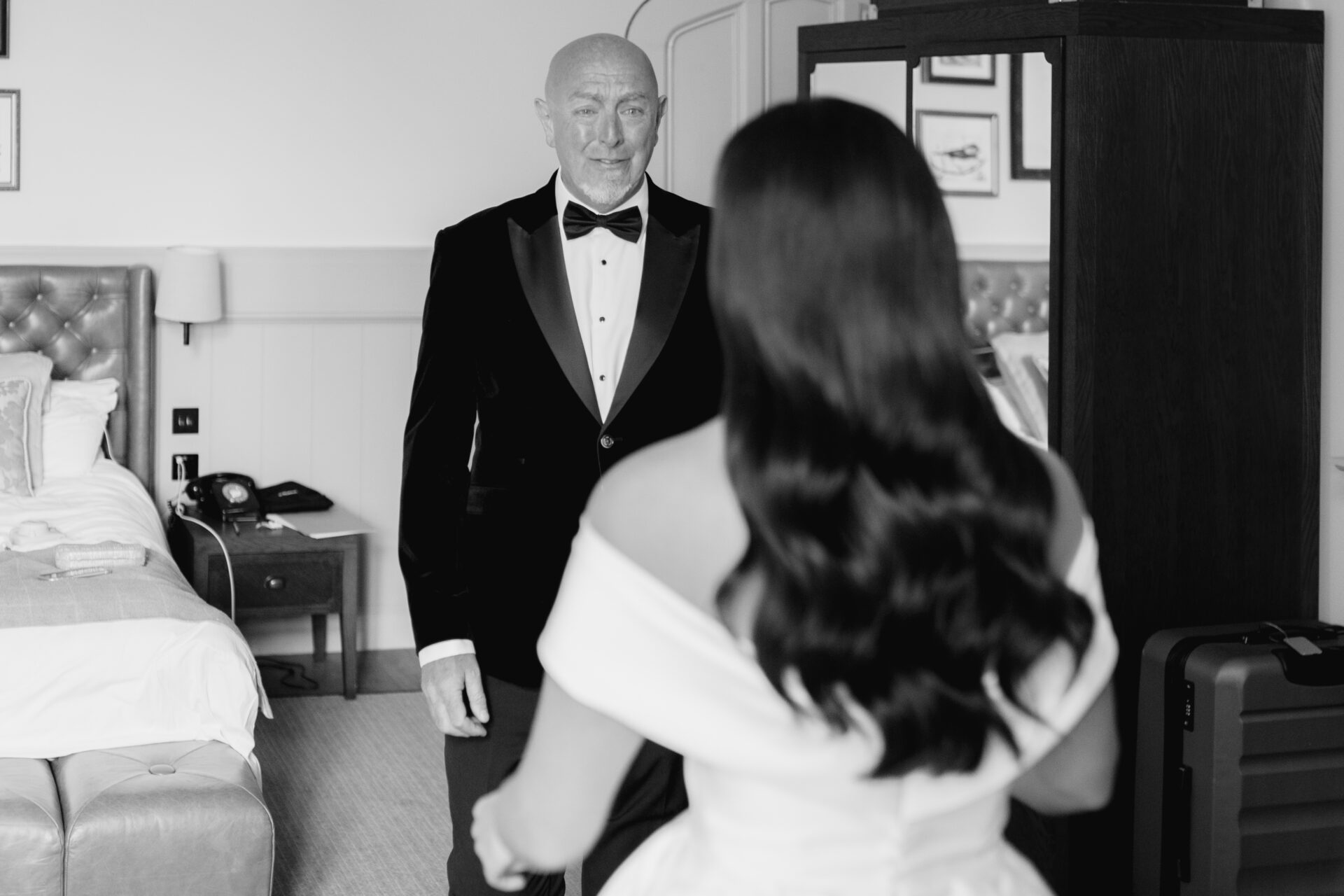 The father of the bride sees his daughter for the first time before her wedding at Tortworth Court