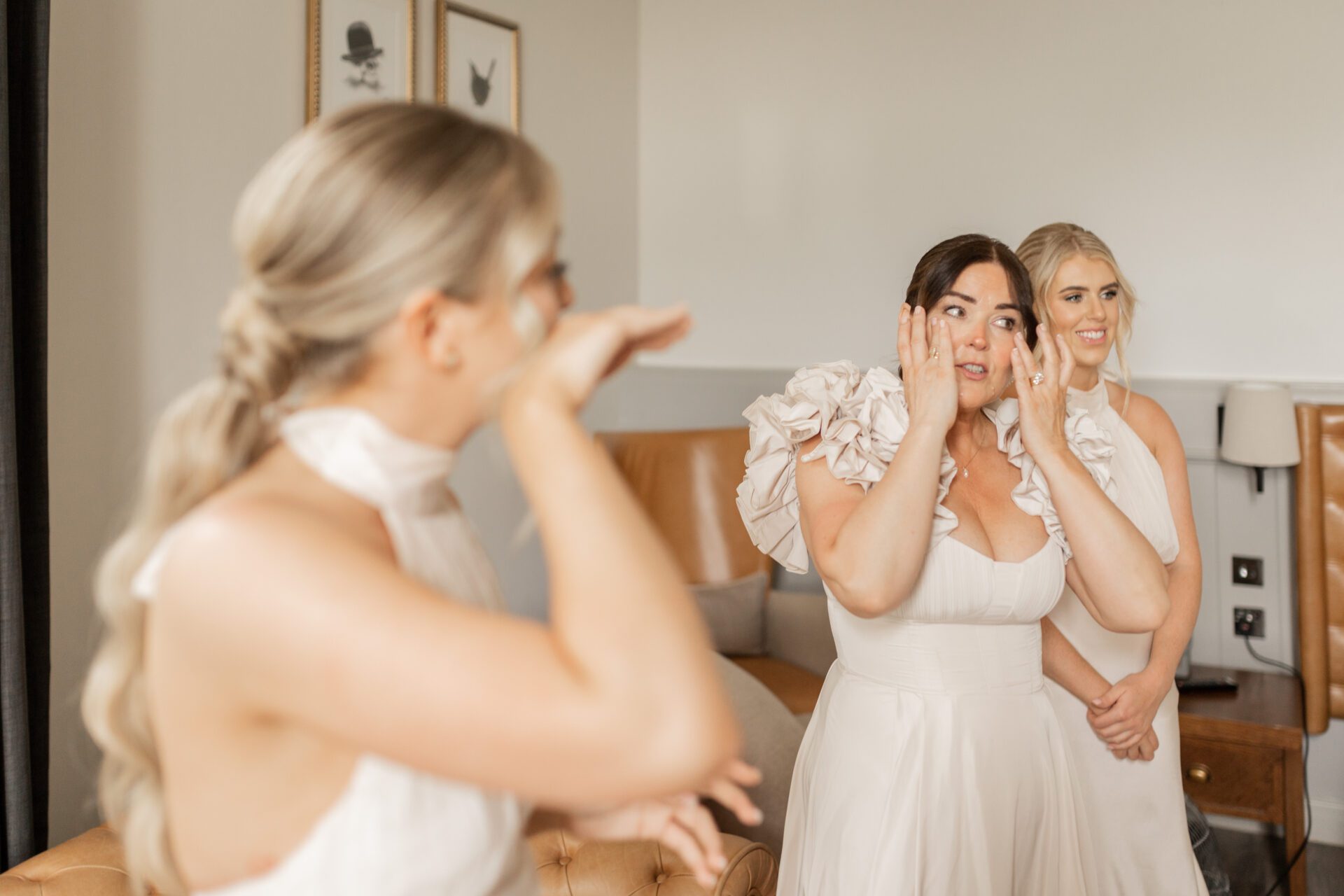 The mother of the bride and bridesmaid shed a tear during the bride's first look at Tortworth Court