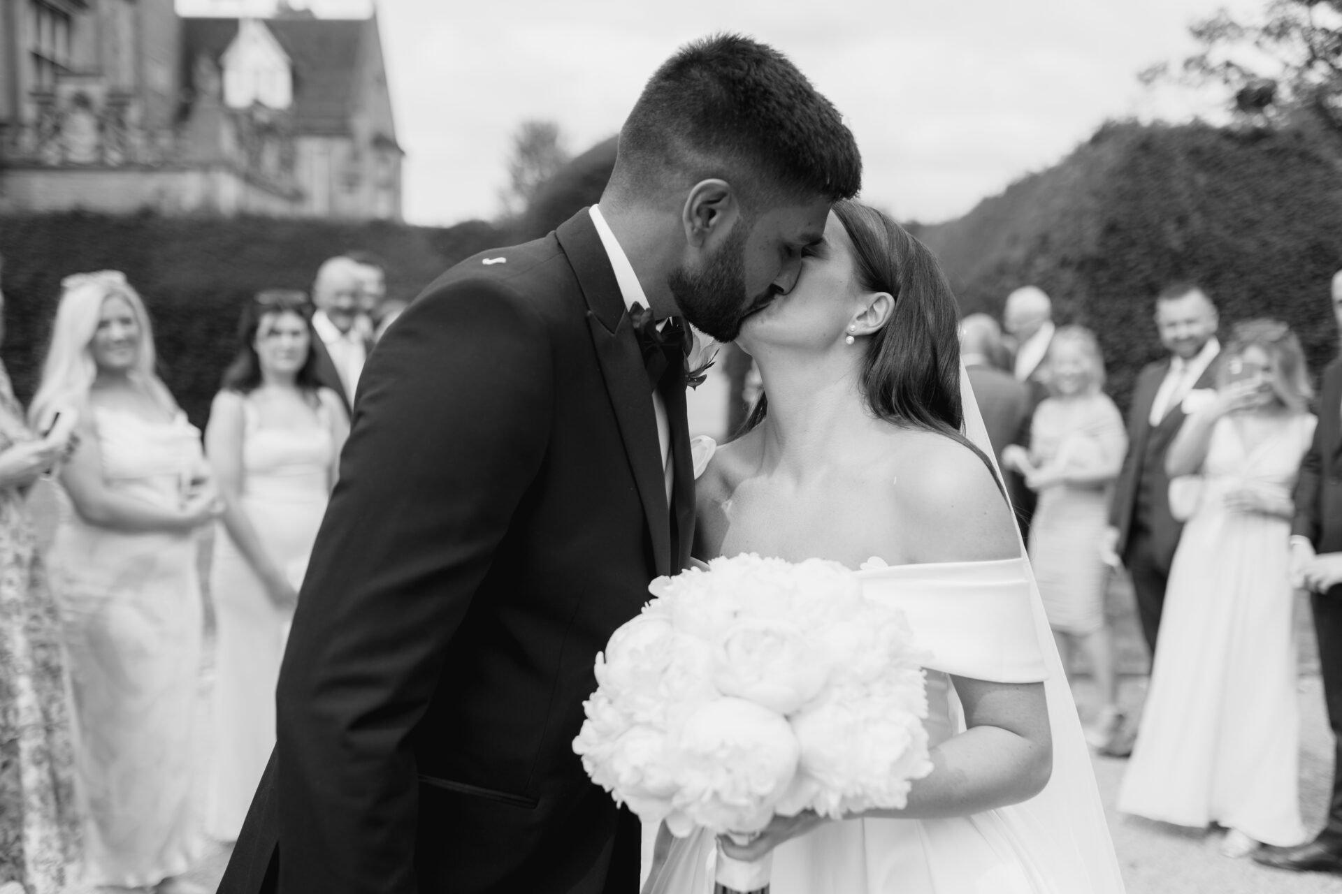 The bride and groom share a kiss at Tortworth Court