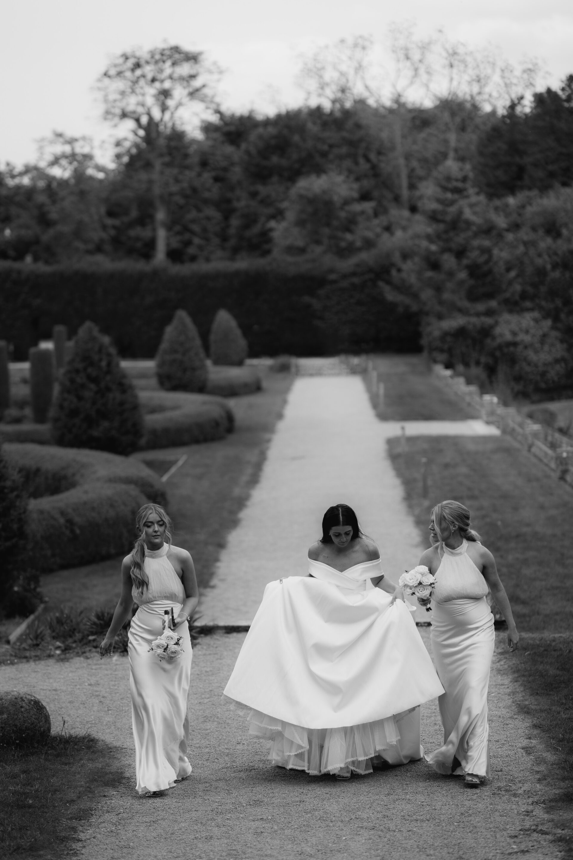 The bride walks with her bridesmaids at Tortworth Court