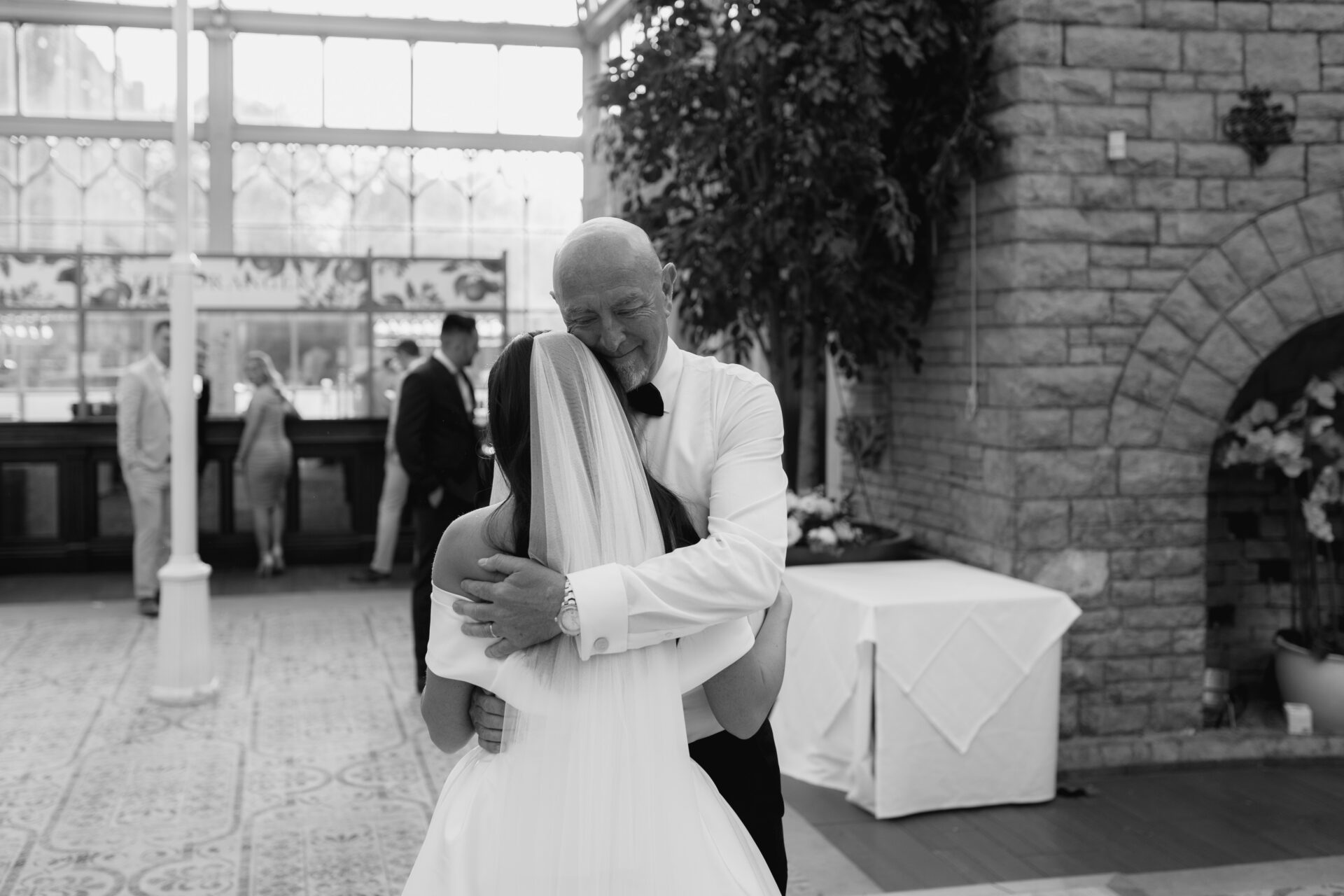 Father and daughter dance in the Orangery at Tortworth Court